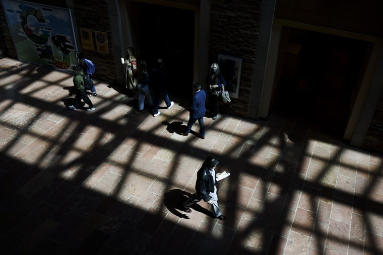 People walk through the University Memorial Center at University of Colorado