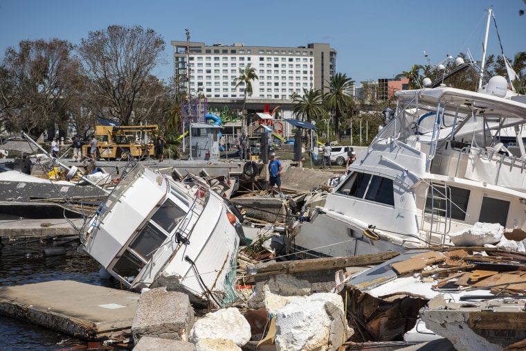 Boats lie in ruin in the marina by Joe’s Crab Shack from the destruction of Hurricane Ian in Fort Myers, Fla. on Friday.