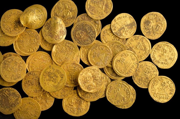 Israeli archaeologists have found 44 pure gold coins dating to the Byzantine era, hidden in a wall at a nature reserve. 