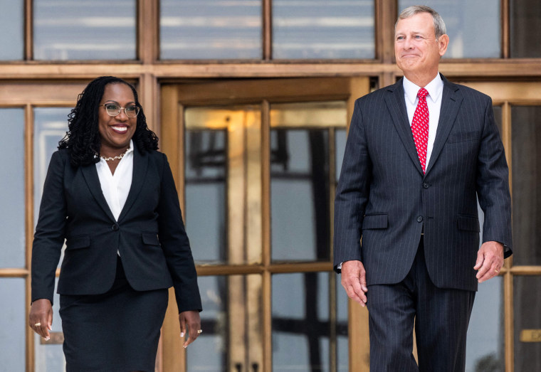 Supreme Court Justice Ketanji Brown Jackson and Chief Justice John Roberts walk out of the Supreme Court, following her investiture ceremony on Sept. 30, 2022.