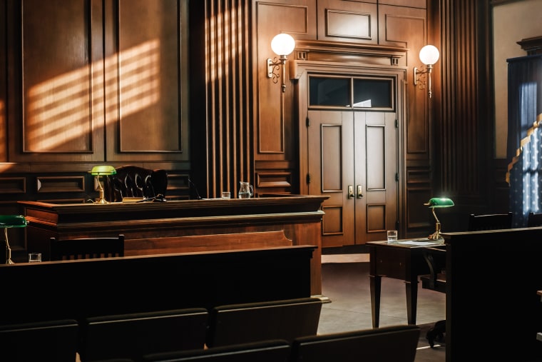 Empty American Style Courtroom. Supreme Court of Law and Justice Trial Stand. Courthouse Before Civil Case Hearing Starts. Grand Wooden Interior with Judge's Bench, Defendant's and Plaintiff's Tables.