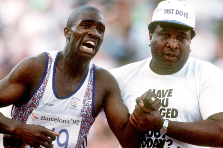 Great Britain's Derek Redmond is helped by his father, Jim, as he limps to the finish line at the Barcelona Olympic Games in 1992.