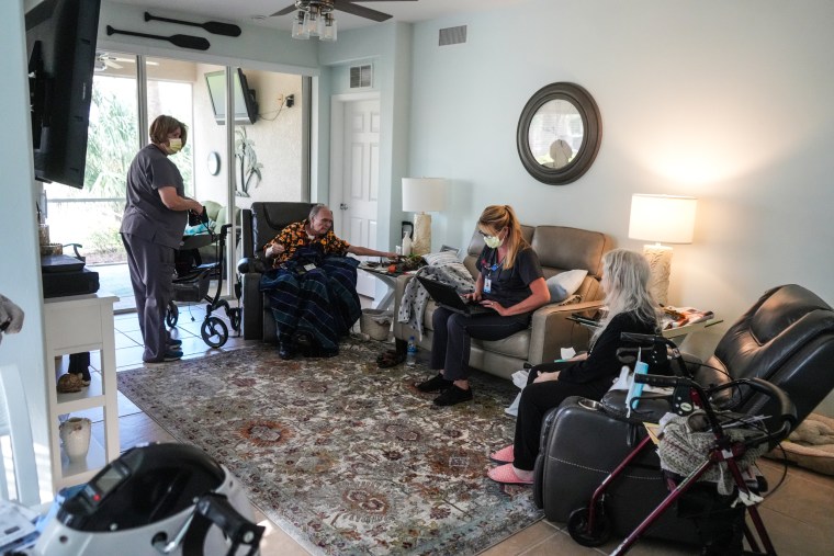 Roy and Sara Key, along with DispatchHealth staff, at their Florida condo.