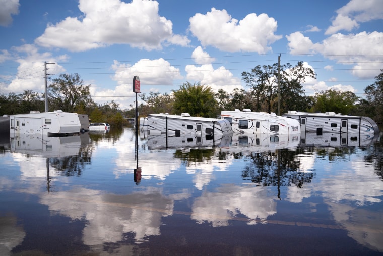 Flooded travel trailers at the Peace River Campground, in Arcadia, Fla., on Oct. 4, 2022. Fifty miles inland, and nearly a week after Hurricane Ian made landfall on the gulf coast of Florida, the record breaking floodwaters in the area are receding to reveal the full effects of the storm. (Photo by Sean Rayford/Getty Images)