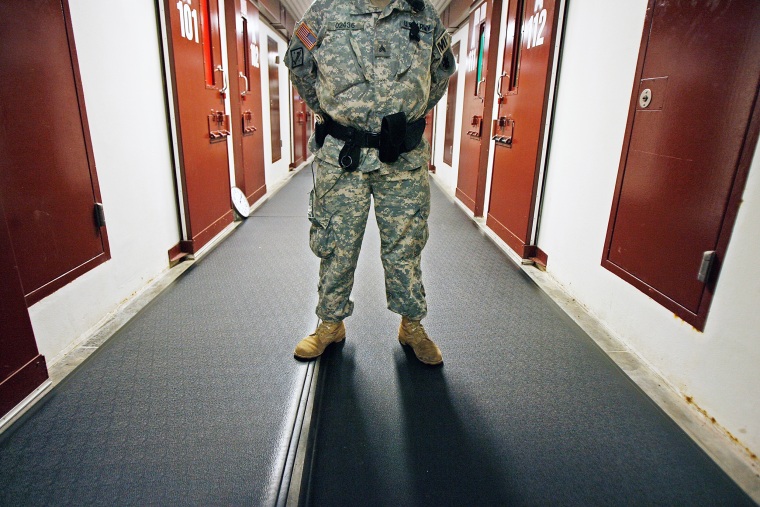 A U.S. Army guard stands ready inside Camp 5 in the detention facility at the U.S. Naval Station in Guantanamo Bay, Cuba