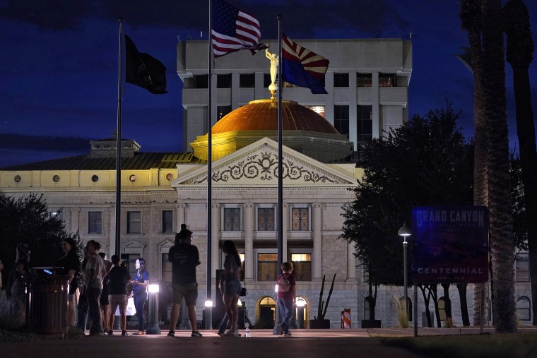 Protesters gather outside the Capitol to voice their dissent with an abortion ruling, in Phoenix, on Sept. 23, 2022. An Arizona judge ruled the state can enforce a near-total ban on abortions that has been blocked for nearly 50 years. The law was first enacted decades before Arizona became a state in 1912.