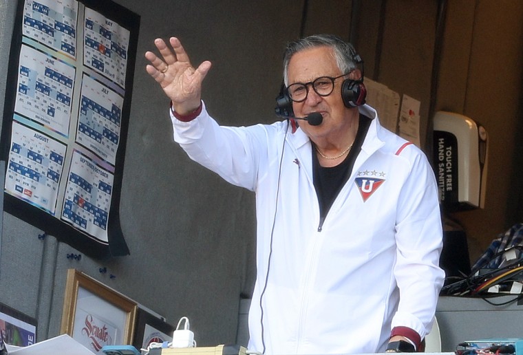 Jaime Jarrín waves to the crowd in his final regular season game at Dodger Stadium