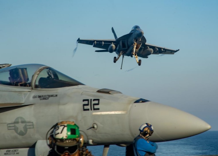 An F/A-18F Super Hornet approaches for a landing on the flight deck of the USS Ronald Reagan