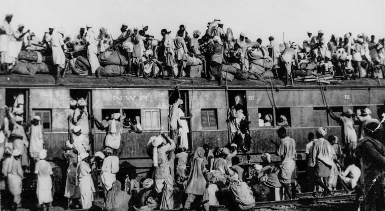 Hundreds of Muslim refugees crowd atop a train leaving New Delhi for Pakistan, September 1947.