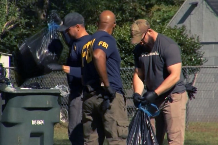 Members of the FBI assist the Chatham County Police Department in the search for toddler Quinton Simon in Georgia, on Monday.