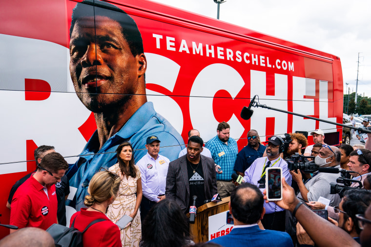 Herschel Walker and Former ambassador Nikki Haley speak with the press during Herschel's Unite Georgia Bus Stop rally at the Global Mall in Norcross, Ga., on Sept. 9, 2022.