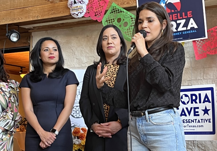 Eochelle Garza, center, looks on as actress and activist America Ferrera speaks at an event in Dallas.