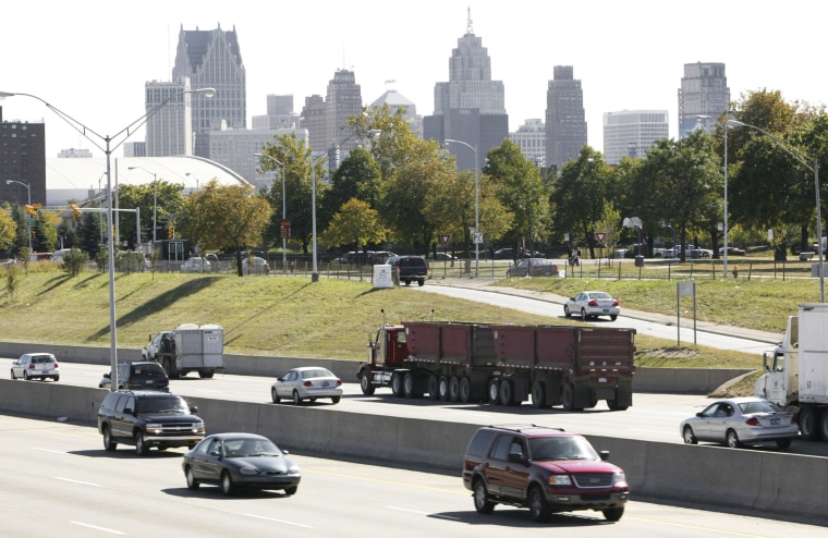 Cars drive on I-375 near downtown Detroit