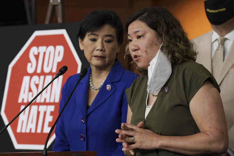 Rep. Judy Chu, D-Calif., and Rep. Grace Meng, D-N.Y., standing next to a "Stop Asian Hate " sign, speak during a press conference about of the Covid-19 Hate Crime Act on Capitol Hill on May 18, 2021.