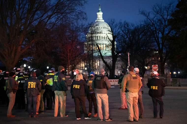 FBI agents arrive at Capitol Hill in Washington, D.C., on Jan. 6, 2021. The U.S. Capitol was placed under lockdown and Vice President Mike Pence left the floor of Congress as hundreds of protesters swarmed past barricades surrounding the building where lawmakers were debating Joe Biden's victory in the Electoral College.