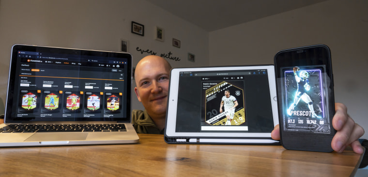 NFT trading card collector Christian Feule shows his collection on his various devices in Germany in 2021.