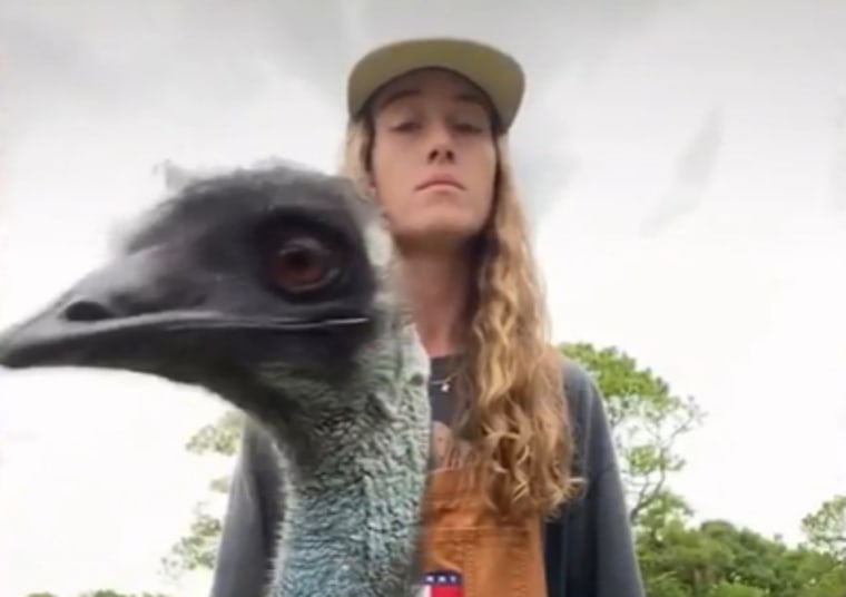 Taylor Blake and Emmanuel, an emu, of Knuckle Bump Farms.