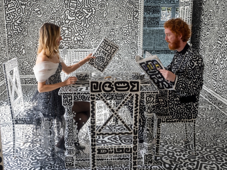 "Mr. and Mrs. Doodle" at their dining room table. 