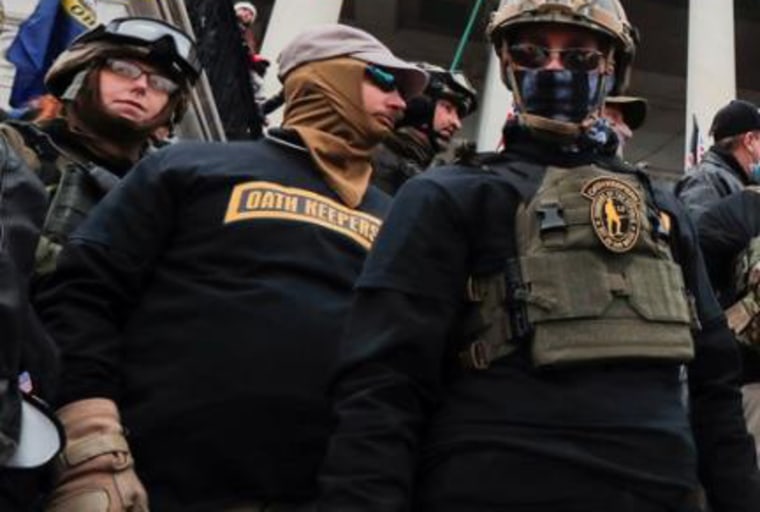 Jason Dolan, center, at the Capitol on Jan. 6, 2021.