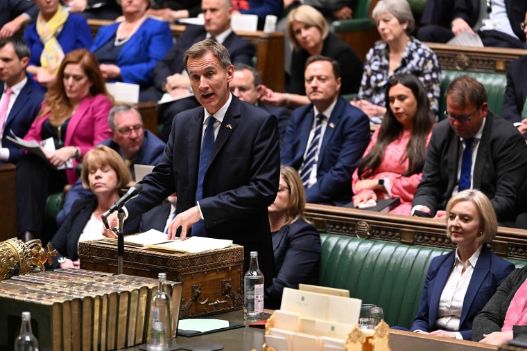Britain's Chancellor of the Exchequer Jeremy Hunt at the House of Commons in London on Monday with Liz Truss seated on the right.