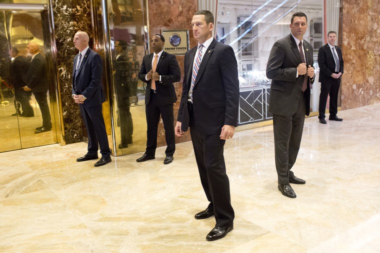 A secret service detail clears out the lobby in the Trump Tower just before a surprise downstairs visit by Donald Trump on January 13, 2017. The area around Trump Tower, in the heart of midtown Manhattan, is filled with high end luxury shops, expensive hotels, tourists visiting the city, and now, journalists, protestors, and extra law enforcement protecting Donald Trump's New York City residence.