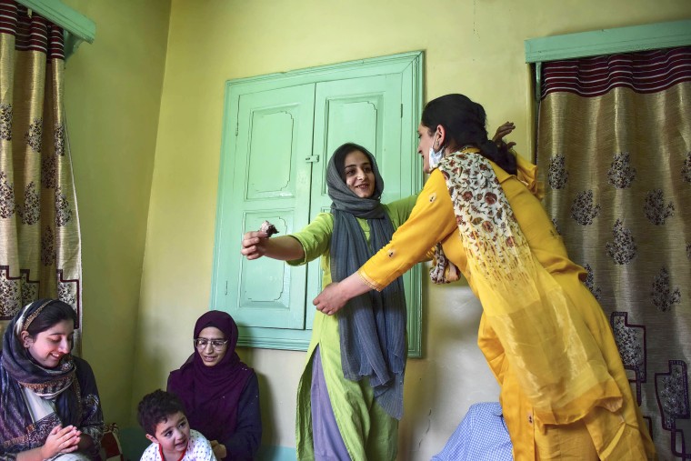 Kashmiri woman photojournalist Sanna Irshad Mattoo, center, celebrates at her residence in Srinagar, on May 20, 2022. Sanna Irshad Mattoo, a 28-year-old woman photojournalist from Kashmir, won the 2022 Pulitzer Prize for feature photography. Sanna is among the four Reuter photojournalists who have won the prestigious award.