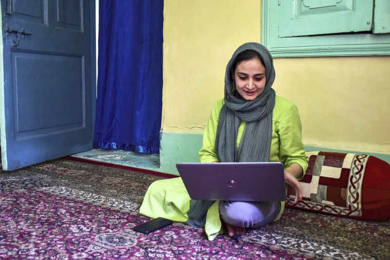 Kashmiri woman photojournalist Sanna Irshad Mattoo uses a laptop at her residence in Srinagar, on May 10, 2022. Sanna Irshad Mattoo, a 28-year-old woman photojournalist from Kashmir, won the 2022 Pulitzer Prize for feature photography. Sanna is among the four Reuter photojournalists who have won the prestigious award.