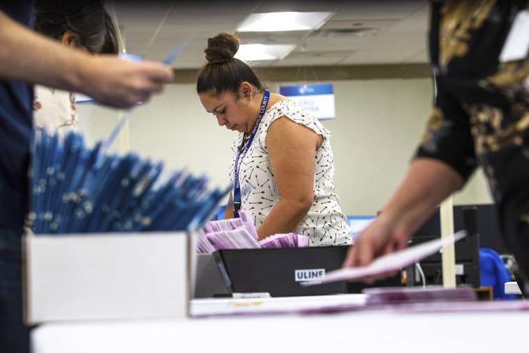 County workers check mails in ballots. Nevada conducting its primary election.