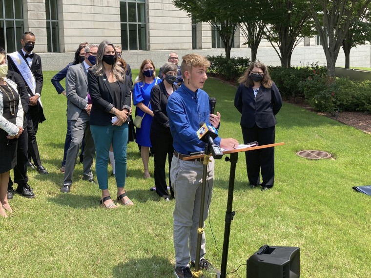 Dylan Brandt speaks at a news conference outside the federal courthouse in Little Rock