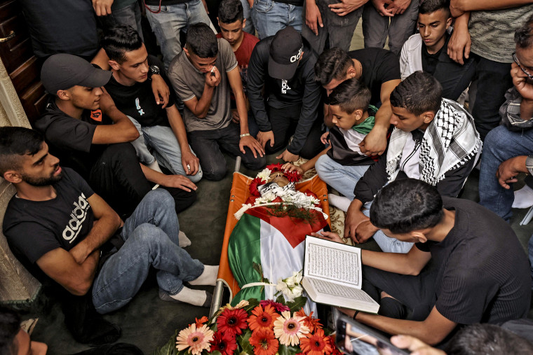 Image: Palestinian mourners attend the funeral of Mohammad Fadi Nuri, 16, who died from a gunshot wound sustained during clashes with Israeli forces near Ramallah last month, on Oct. 20, 2022 in Ramallah, in the occupied West Bank.
