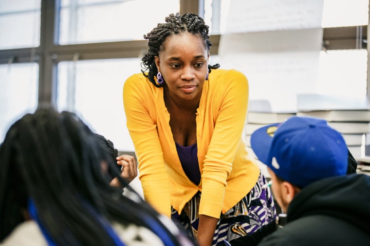 Shannah Henderson speaks with a student during an AP African American Studies course at Brooklyn Preparatory High School