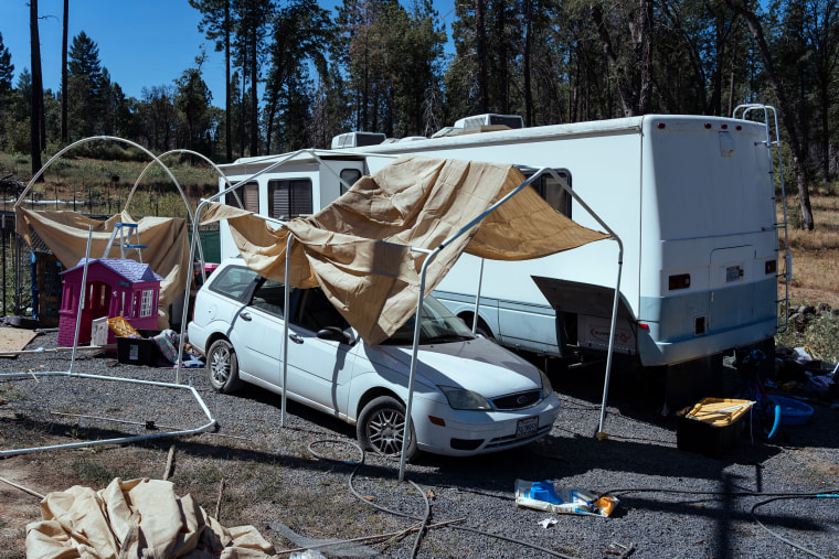 Inez Salinas's temporary trailer home and her car in Concow, Calif.