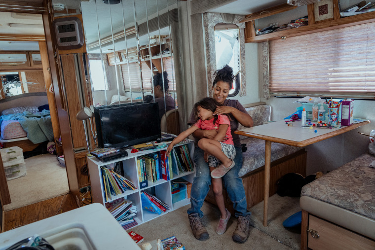 Inez Salinas and River inside their trailer in September.