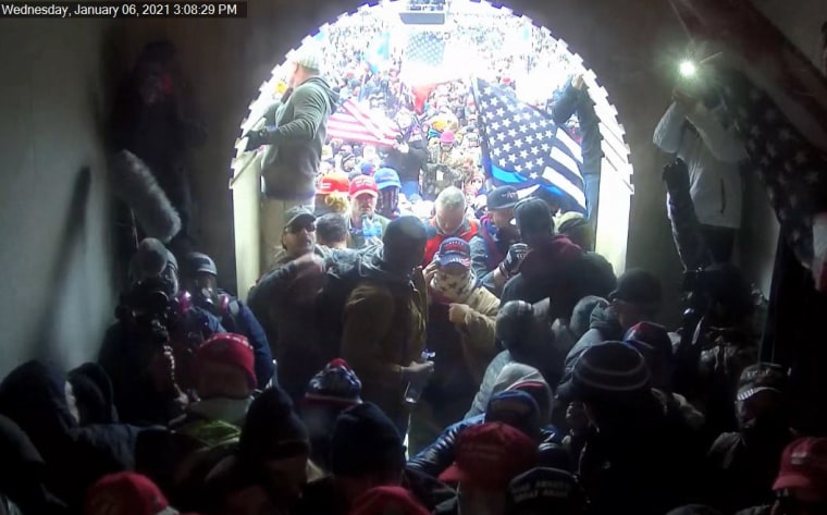 Mark Mazza, wearing a cap and a scarf with stars, at the Capitol on Jan. 6, 2021.