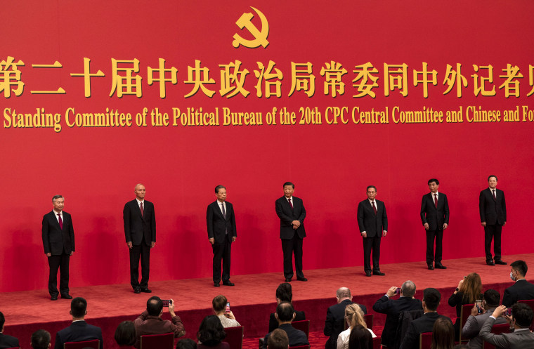 Members of the new Standing Committee of the Political Bureau of the Communist Party of China stand for a group photo at The Great Hall of People on October 23, 2022, in Beijing.
