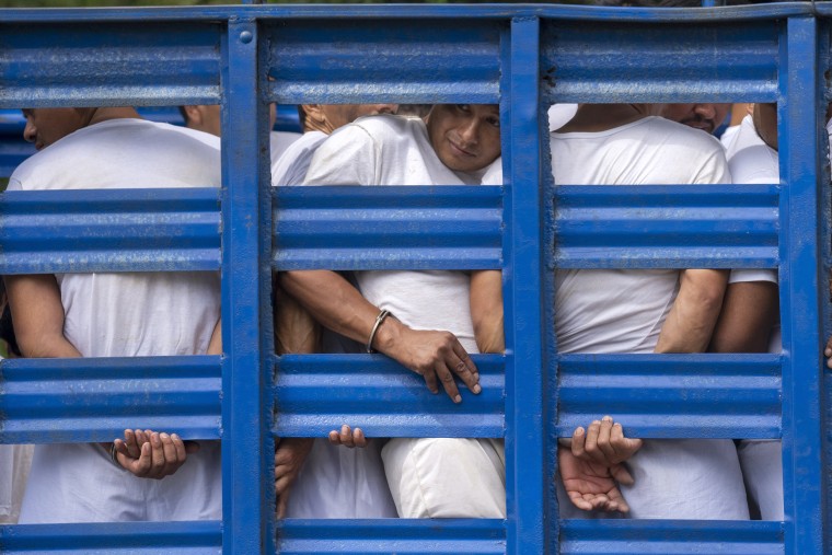 Men detained under the "state of exception" are transported to a detention center in a cargo truck, in Soyapango, El Salvador, Friday, Oct. 7, 2022. On March 26, El Salvadorâ€™s street gangs killed 62 people across the country, igniting a nationwide furor. President Nayib Bukele and his allies in congress launched a war against the gangs and suspended constitutional rights. The arrests under the "state of exception" of more than 55,000 people have swamped an already overwhelmed criminal justice system. Defendants arrested on the thinnest of suspicions are dying in prison before any authority looks closely at their cases.