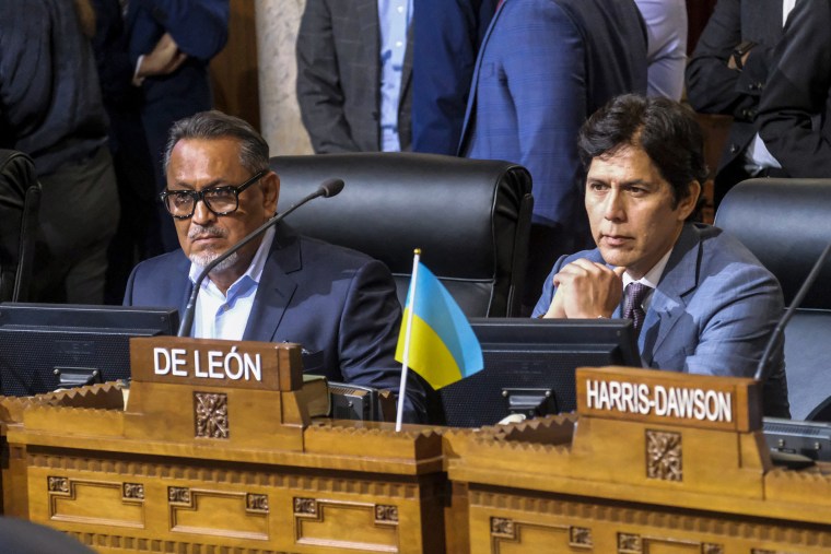 Los Angeles City Council members Gil Cedillo, left, and Kevin de Leon sit in chamber before a city council meeting on Oct. 11, 2022.