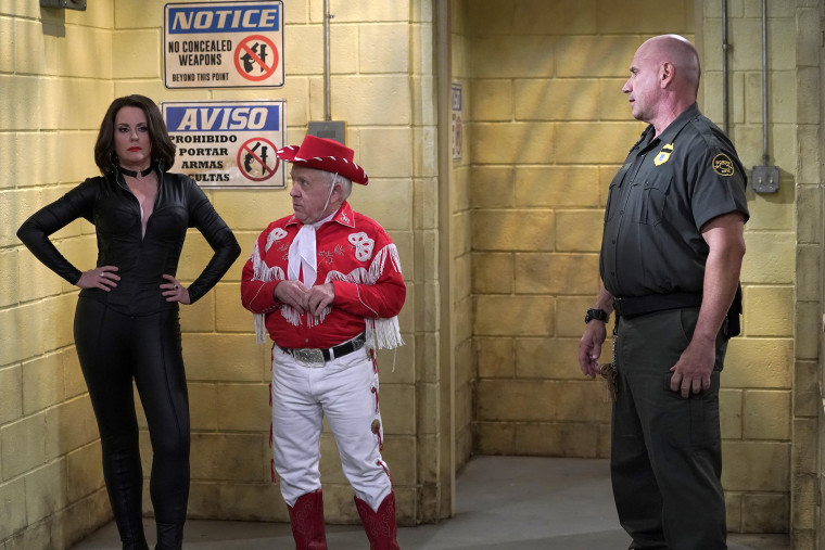 Megan Mullally as Karen Walker, Leslie Jordan as Beverley Leslie, Bruno Amato as Officer Randy in an episode of "Will and Grace."
