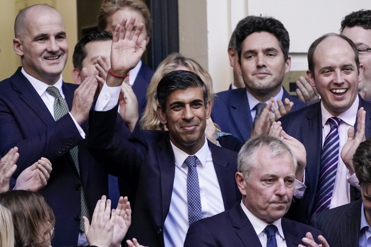Rishi Sunak waves after winning the Conservative Party leadership contest at the Conservative party Headquarters in London on Oct. 24, 2022.