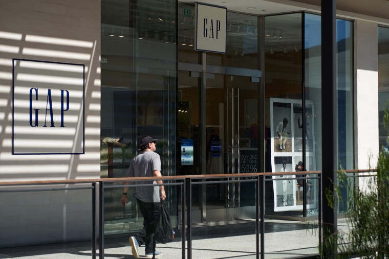 A man walks in front of a Gap retail store in Los Angeles.