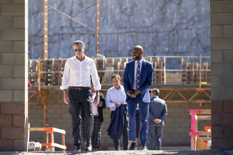 Governor Gavin Newsom, left, and Antioch mayor Lamar A. Thorpe visit the construction site of a new desalination plant in Antioch, Calif., on Aug. 11, 2022.