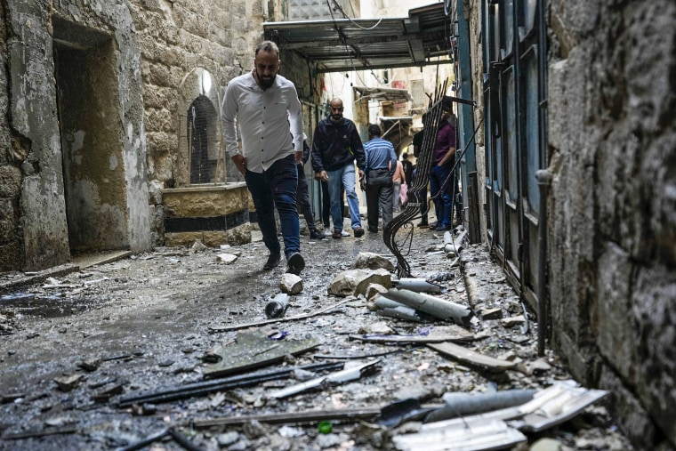 Image: Palestinians gather at the site where Israeli forces destroyed an explosive lab belonging an armed group calling itself the Lions' Den, in the occupied West Bank city of Nablus, on Oct. 25, 2022. 