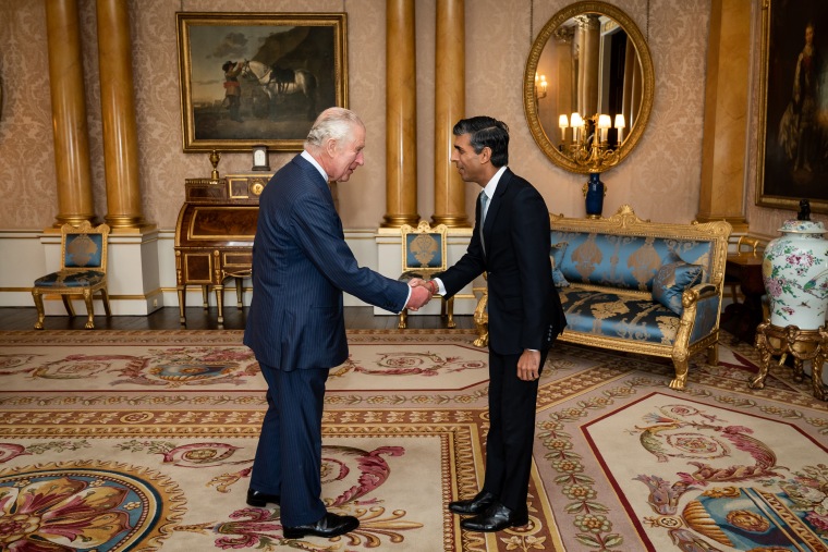 King Charles III welcomes Rishi Sunak during an audience at Buckingham Palace, London, where he invited the newly elected leader of the Conservative Party to become Prime Minister and form a new government, on Oct. 25, 2022.
