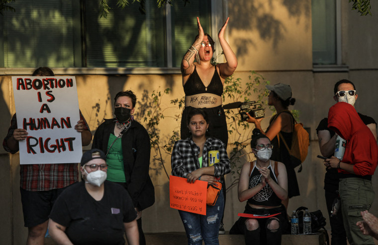 Image: Abortion rights protesters chant during a rally at the Tucson Federal Courthouse on July 4, 2022  in Tucson, Ariz.