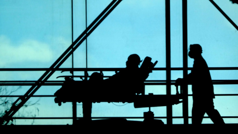 A patients is moved between wings at the Mount Sinai Morningside Hospital on Feb. 25, 2022, in New York. 