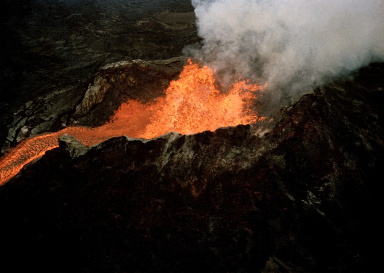 Image: Lava flows downhill from the crater of Mauna Loa, on April 5, 1984. Hawaii officials are warning residents that the world’s largest active volcano, Mauna Loa, is sending signals that it may erupt.