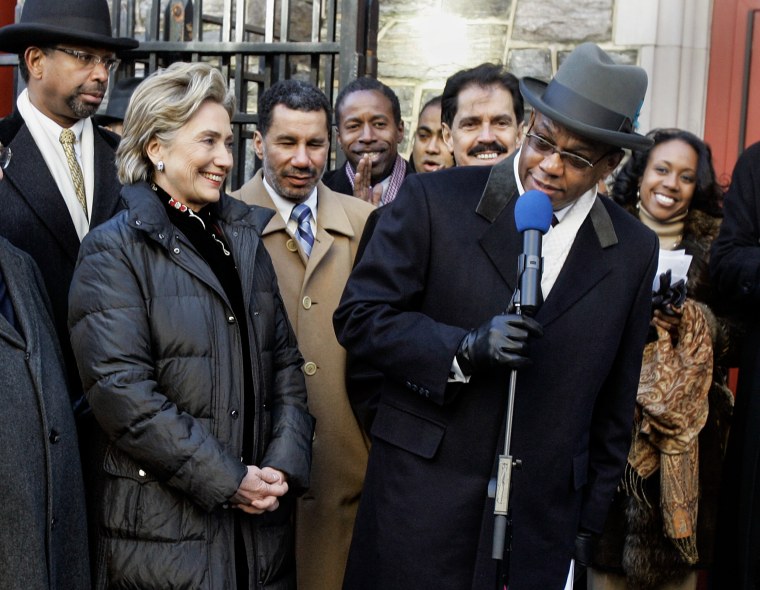 Image: Hillary Clinton stands with Rev. Dr. Calvin O. Butts outside the Abyssinian Baptist Church on Jan. 20, 2008 as Butts endorses Clinton's candidacy in Harlem, New York on Jan. 20, 2008 . 