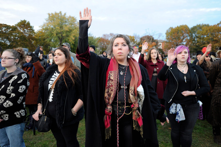 Witches take part in the Witches' Magic Circle in Salem, Mass., on Oct. 31, 2018. 