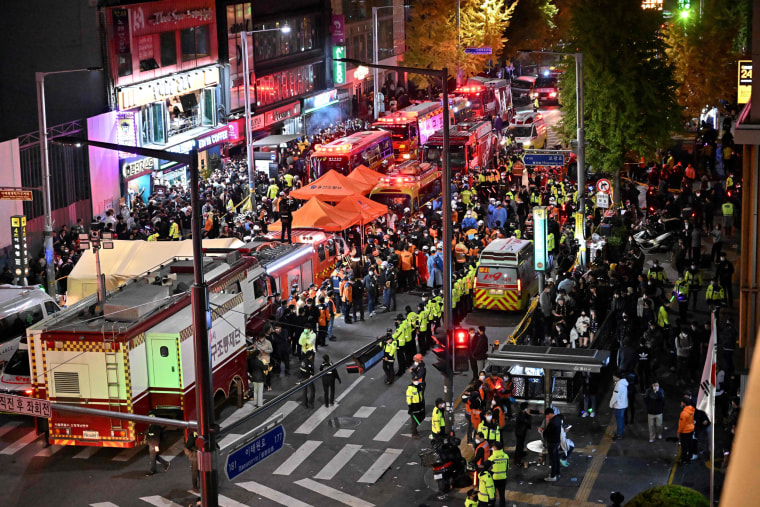 Crowds gather around the scene of crushing accident