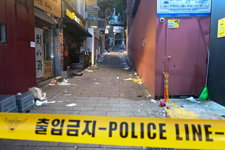 Police tape cordons off the entrance to one of the narrow alleys where the stampede occurred Saturday, Oct. 29, 2022, in Seoul, South Korea. 